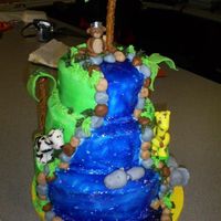 Jungle Baby Shower Cake I made this cake for my boss, who is having a baby boy, and her nursery has a jungle theme. My sister made the little animals for me out of...