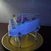 Grand Piano #1 I made 2 of the same cake on the same weekend. This one was for my sister's birthday. I found the Wilton Grand Piano set on Ebay,...