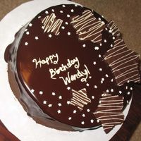 Wendy's Birthday Cake My first attempt at Ganache! I love the way it looks, that perfect shine :). I used ghirardelli's bitter sweet chocolate for the...
