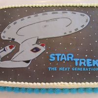 Star Trek: The Next Generation Enterprise My mom and I teamed up on this cake for my birthday. I LOVE Star Trek: TNG. I cut the Enterprise out of gray Wilton fondant and painted it...