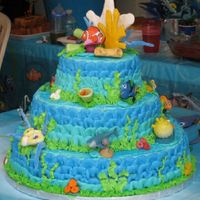 Finding Nemo Reef White chocolate cake with buttercream frosting. All the Nemo figurines are store bought and the coral is made of fondant.