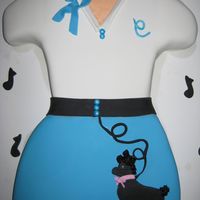 Poodle Skirt Sculpted out of 2 18X11 cakes. I got the idea from a Google web search and just used the colors that the birthday girl was wearing.