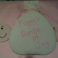 Bundle Of Joy -Girl I got the idea for this cake from the Wilton website. It is a 14" heart cake covered in fondant with fondant details (face and foot)....