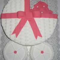 Baby Girl Carriage I made this cake for a co-worker's baby shower. It is vanilla cake with buttercream and fondant ribbon. Thanks for looking!