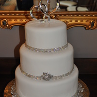 Bling Wedding Cake Three tier 10'', 8'', 6'' red velvet cake with cream cheese filling, covered in Satin Ice fondant. Wrapped...