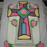 Lydia's First Communion 2-Layer cake with Marshmallow Fondant and chocolate stained glass applique. Buttercream roses.