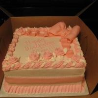 Img_0215.jpg For the mother of a special friend. White cake, buttercream icing, fondant accents, plastic pearls.