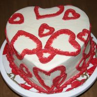 Valentine's Cake Dark chocolate fudge cake with strawberry filling and white chocolate buttercream. Brushed embroidery hearts. I used 2 sizes of cookie...