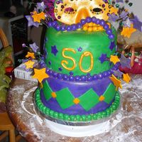 Mardi Gras 50Th Birthday White Cake w/fresh strawberry filling. Covered in fondant w/gumpaste accents.