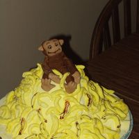 Curious George Birthday Cake Carved cake in shape of mountain, MMF. Geoorge and bananas molded out of MMF and painted with food safe markers. Made for my daughter'...