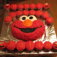 Elmo Cake And Cupcakes Used the Wilton pan to make this cake and decorated the cupcakes for extra cake. This was for my daughter's first birthday.
