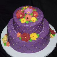 Bridal Shower Each tier was vanilla cake with raspberry filling. Iced in purple buttercream with fondant flowers. Used my diamond pressing mat and put...