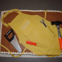 A Carpenter's 80Th Birthday A sheet cake for an 80th birthday. Carpenter's apron out of fondant with play tools to accent.