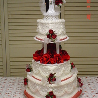 Red/ White Heart Tiered Wedding Cake Heart Shaped Tiers in Red and White. Silk flowers made this last minute cake beautiful