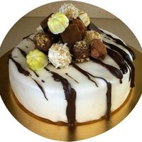 Stack Of Chocolates Single cake covered in frondant, then drizzled with melted chocolate and topped with a stack of homemade chocolates and truffles