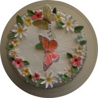 Butterflies And Flowers Very simple cake, with gumpaste flowers and butterflies floating above on curled florist wire
