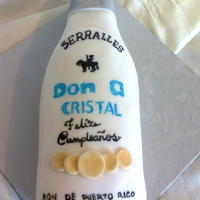 Don Q Cristal Bottle Don Q Cristal bottle cake, covered in MFF. Label is fondant painted on with edible markers after dry.