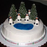 Penguin Pals Cake design inspired by a portrait on cakecentral. Made for a Christmas party with friends. Iced using buttercream icing, fondant...