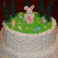 Hippity Hop Easter Cake Buttercream icing with basketweave details. Fondant bunny and easter eggs.