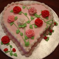 Valentine's Sweetheart Cake Heart-shaped cake with buttercream icing and roses.