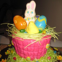 Easter Bunny chocolate cake with basket made out of rkt. handle broke hand to put a wire to hold it together.