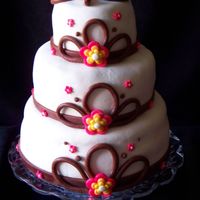 Bebony.jpg This was my sister's b-day cake; top was 4 inch coconut cake and chocolate filling' middle was 6 inch red velvet and coconut...