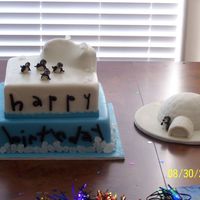Happy Feet Birthday Cake Bottom is chocolate and top tier is white. All mmf with mmf accents with rock candy for the bottome border. I have ALOT of fun doing this...