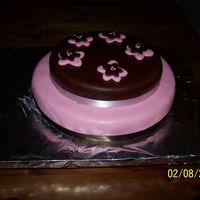 Pink Flowers bottom layer is chocolate cake and top layer is vanilla. everything is decorated with MMF.