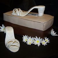 Le Josefina Shoe Line Strawberry cake covered in chocolate MMF with gumpaste flowers and shoes. I had alot of fun making this one and everyone at the party loved...