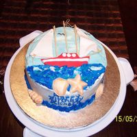 Sailing marble cake with chocolate hazlenut filling and buttercream dream frosting. Fondant boat, rafia rope and wooden skewers for masts. Moulded...