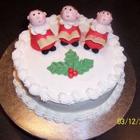 Christmas Choir Boys Fruitcake soaked in whisky, covered in marzipan then iced with royal icing. Choirboys made with marzipan.
