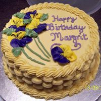 Basket vanilla cake with chocolate hazlenut filling and buttercream dream icing and piped flower decoration