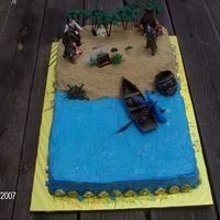 Pirates Of The Caribbean Chocolate with bubblegum flavored BC icing. Sand is light Brown sugar. Water painted with piping gel for reflective effect. Coins around...