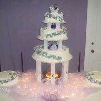 Daughter's Wedding Butter yellow with butter cream icing. Topper was brides choice of Cherished Teddies. She picked this cake from the 1994 Wilton annual. It...