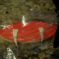 Vampire Lips Used the lips cookie cutter and added gumpaste vampire teeth.