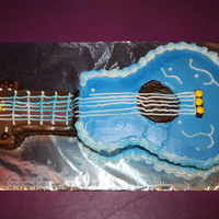 Guitar Cake I carved this cake from a 9x13 cake for my daughter's 8th birthday. I had seen the idea in Family Fun. I used Skittles since my...