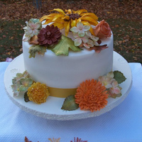 Autumn Theme Birthday Cake 8 inch cake, one layer each, lemon, orange, and pineapple cake, filled with vanilla mousse, frosted with vanilla buttercream, covered with...