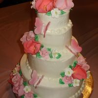 Butterfly Cake Dark choc cake with choc mousse filling.Iced in BC and finished with sugar flowers and butterflies