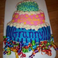 Wilton Topsy Turvey Cake From the Wilton pan, all BC Dream icing with curling ribbon at the bottom