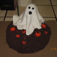 Booo A little chocolate dirt cake with fondant accents.