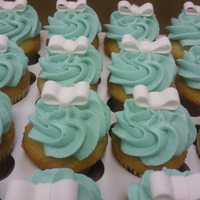 Tiffany Blue With Ribbons Tiffany blue icing with fondant ribbons. These were really fun to make. TFL.