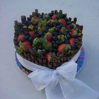 Dsc05005.jpg chocolate devils food cake with white BC topped with strawberrys and blueberries. thanks for looking