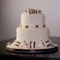 124380118425015.jpg This is my version of Colette Peter's cake-a-roni cake. I ended up putting bread sticks in the top because my modeling chocolate did...