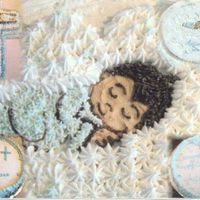 Christening Cake 16in round cake pan, 2 layers decorated with buttercream frosting.