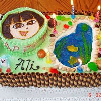 Ali's Dora Cake~ It's Dora~ :D my niece was crazy about her, so I made her the cake for her 9 years old birthday, the pond was made out of jello,...