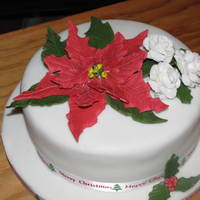 Poinsetta & Roses Fondant/gum paste flowers, lemon cake, fondant covered, thanks to all the beautiful poinsetta cakes for the idea.
