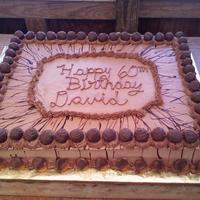 Chocolate Ganache Truffled Cake 2 12 x 18" Vanilla cakes (side by side) filled with chocolate mousse and frosted with chocolate icing. I drizzled ganache on top....