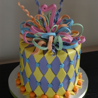 Luisa's 7Th Birthday CC Killer choc cake covered in buttercream and fondant with gumpaste accents and bow. This was an 8" x 6 high tier (3, 2" layers...