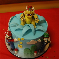 Colton's Mario Cake Playing with the new modeling chocolate tricks I learned from Mike McCary and Lauren Kitchens in Austin. 8x5 inch white cake tier with...