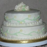 Wedding Round This was actually my 4th wedding cake. The bride wanted small cakes on each table for center pieces and then a 2 tier for her table. I...